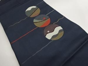 丸に抽象模様織出し名古屋帯